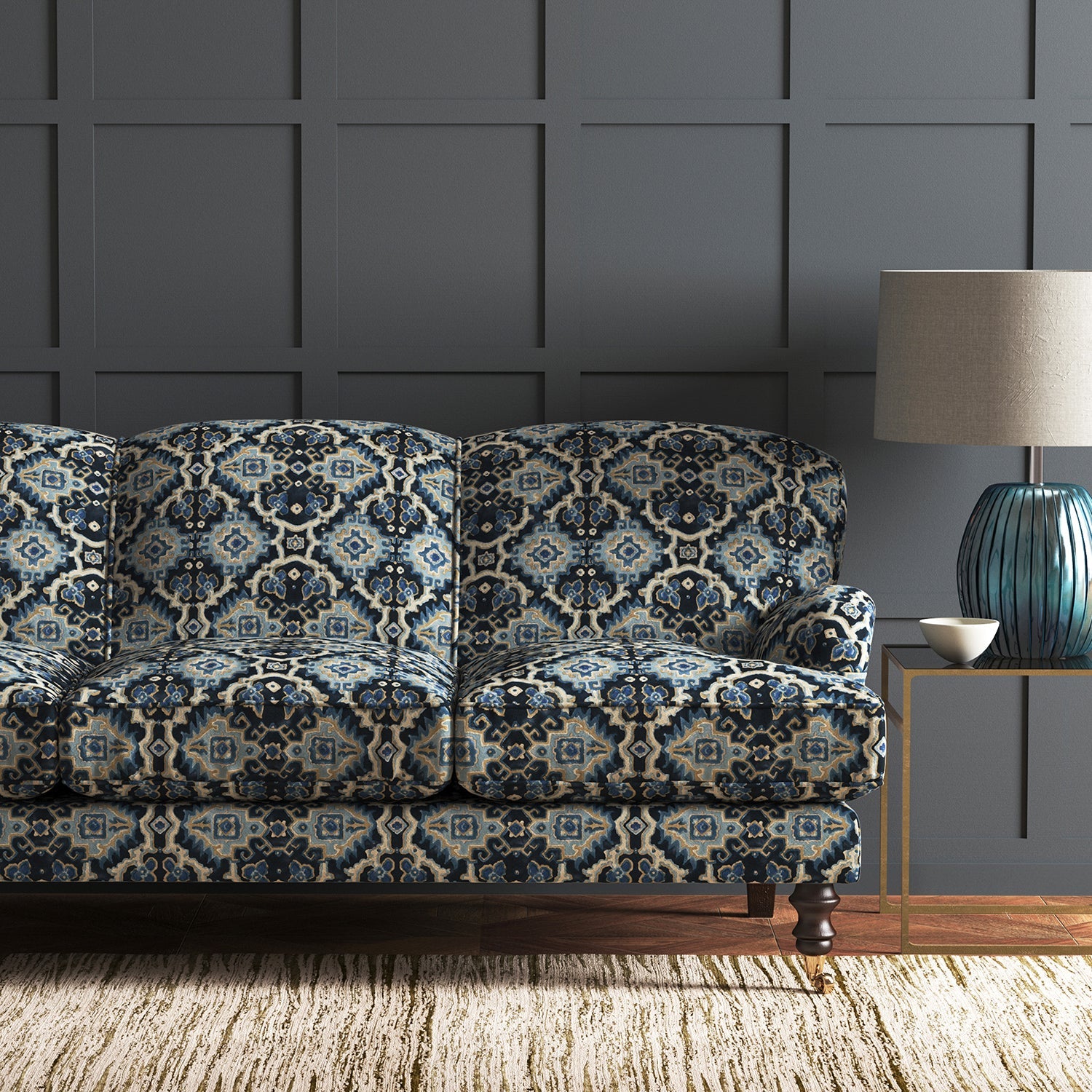 Velvet sofa upholstered in a printed velvet fabric with an oriental geometric design in blue colours