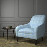 Chair upholstered in a blue Scottish wool plaid check fabric