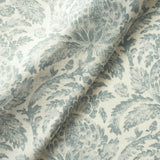 Fabric swatch of a dusky blue vintage inspired floral and leaf design fabric for curtains and upholstery