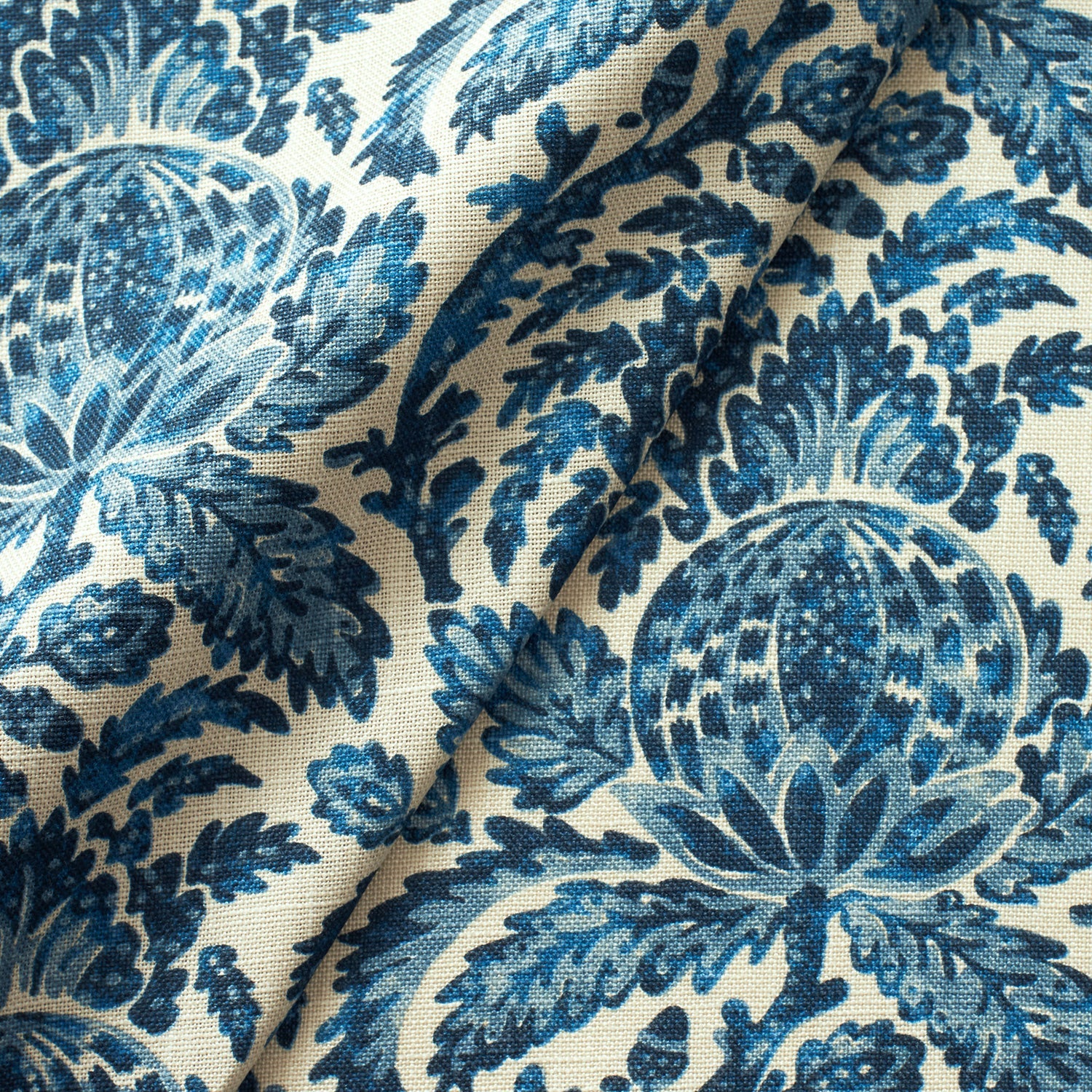 Fabric swatch of a blue vintage inspired floral and leaf design fabric for curtains and upholstery