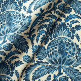 Fabric swatch of a blue vintage inspired floral and leaf design fabric for curtains and upholstery