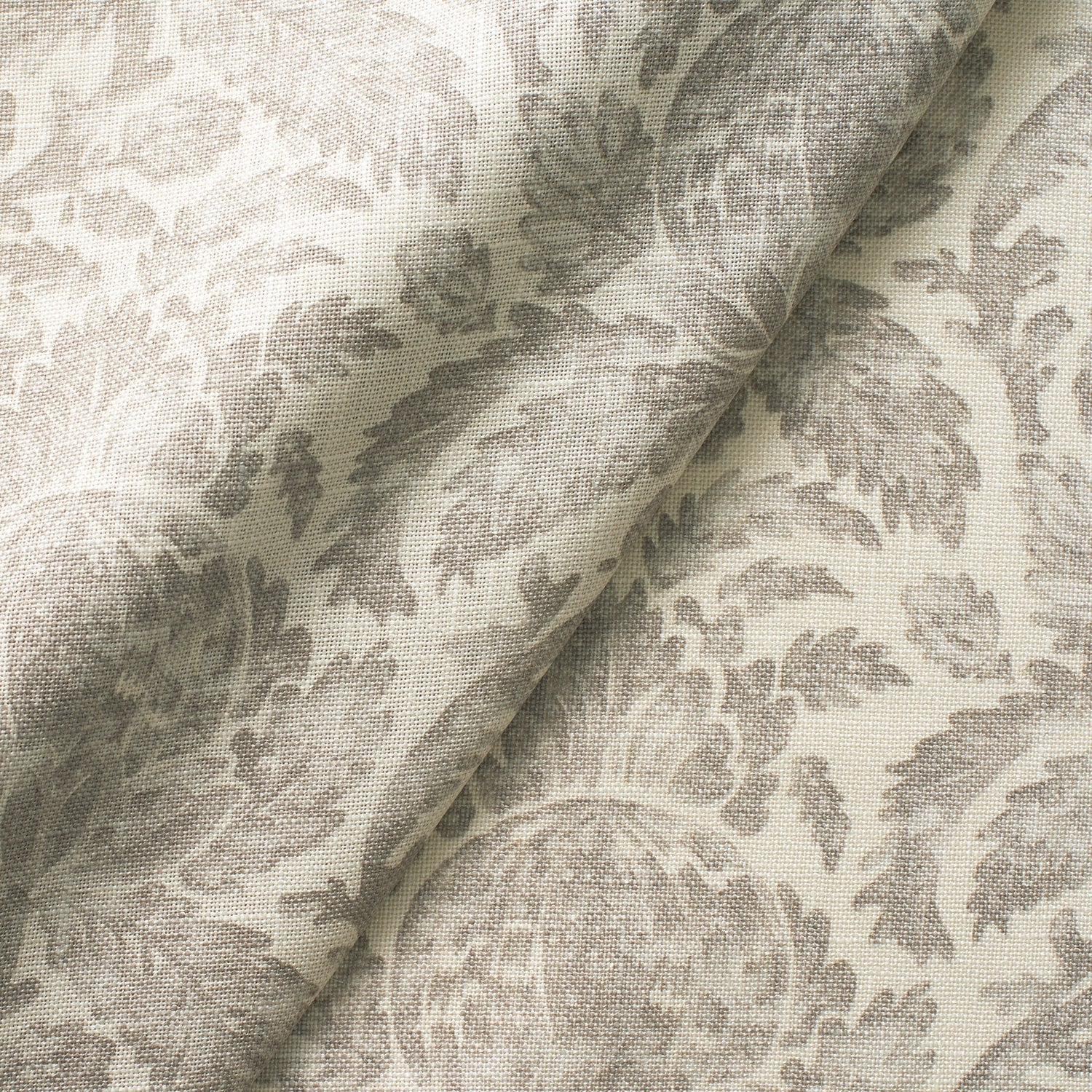 Fabric swatch of a lilac vintage inspired floral and leaf design fabric for curtains and upholstery