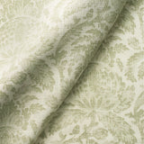 Fabric swatch of a light green vintage inspired floral and leaf design fabric for curtains and upholstery