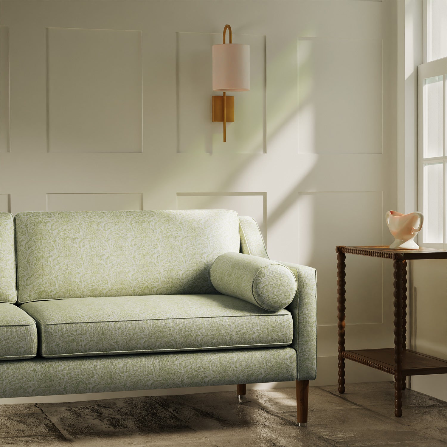 Sofa upholstered in a luxury light green floral and leaf fabric