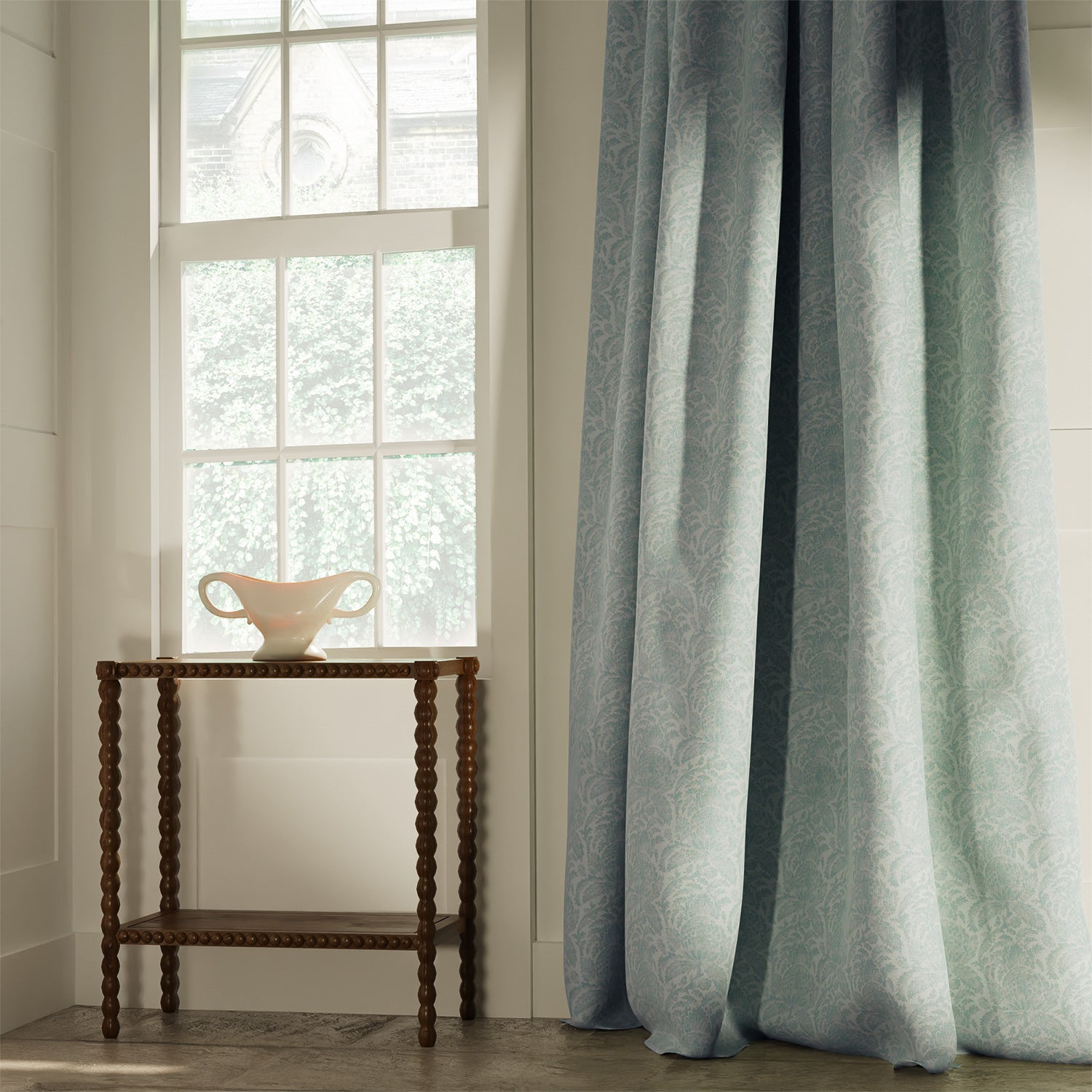 Curtains in a classic duck egg floral and leaf fabric