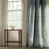 Curtains in a classic dusky blue floral and leaf fabric