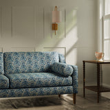 Sofa upholstered in a luxury blue floral and leaf fabric