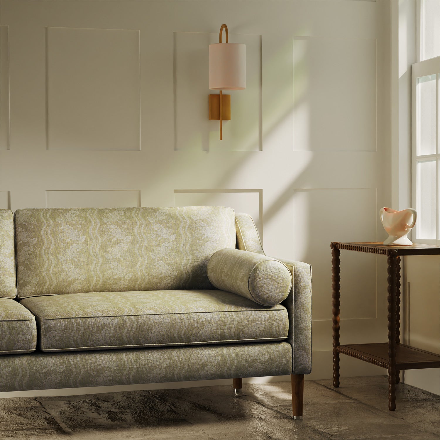 Sofa upholstered in a beige floral fabric with stripe design