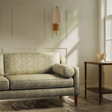 Sofa upholstered in a beige floral fabric with stripe design