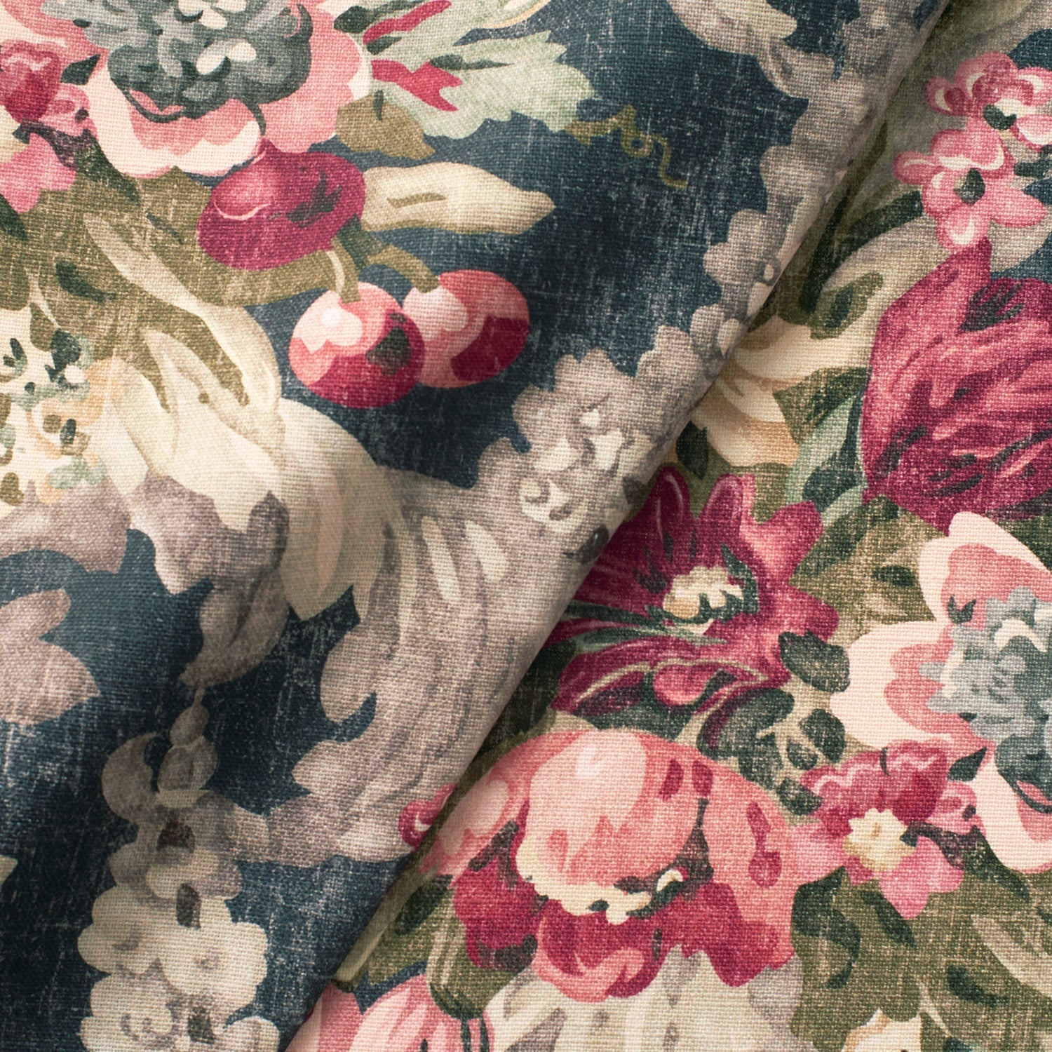 Fabric swatch of a dark blue and pink floral bouquet design fabric for curtains and upholstery
