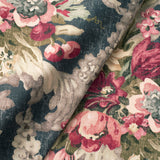 Fabric swatch of a dark blue and pink floral bouquet design fabric for curtains and upholstery