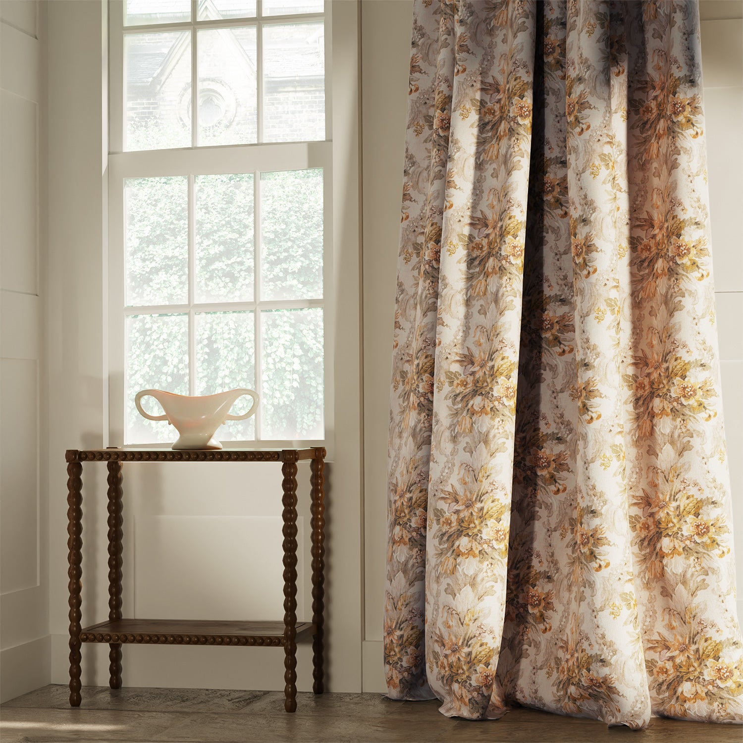 Curtains in a large floral design fabric with gold and cream colours, printed in the UK