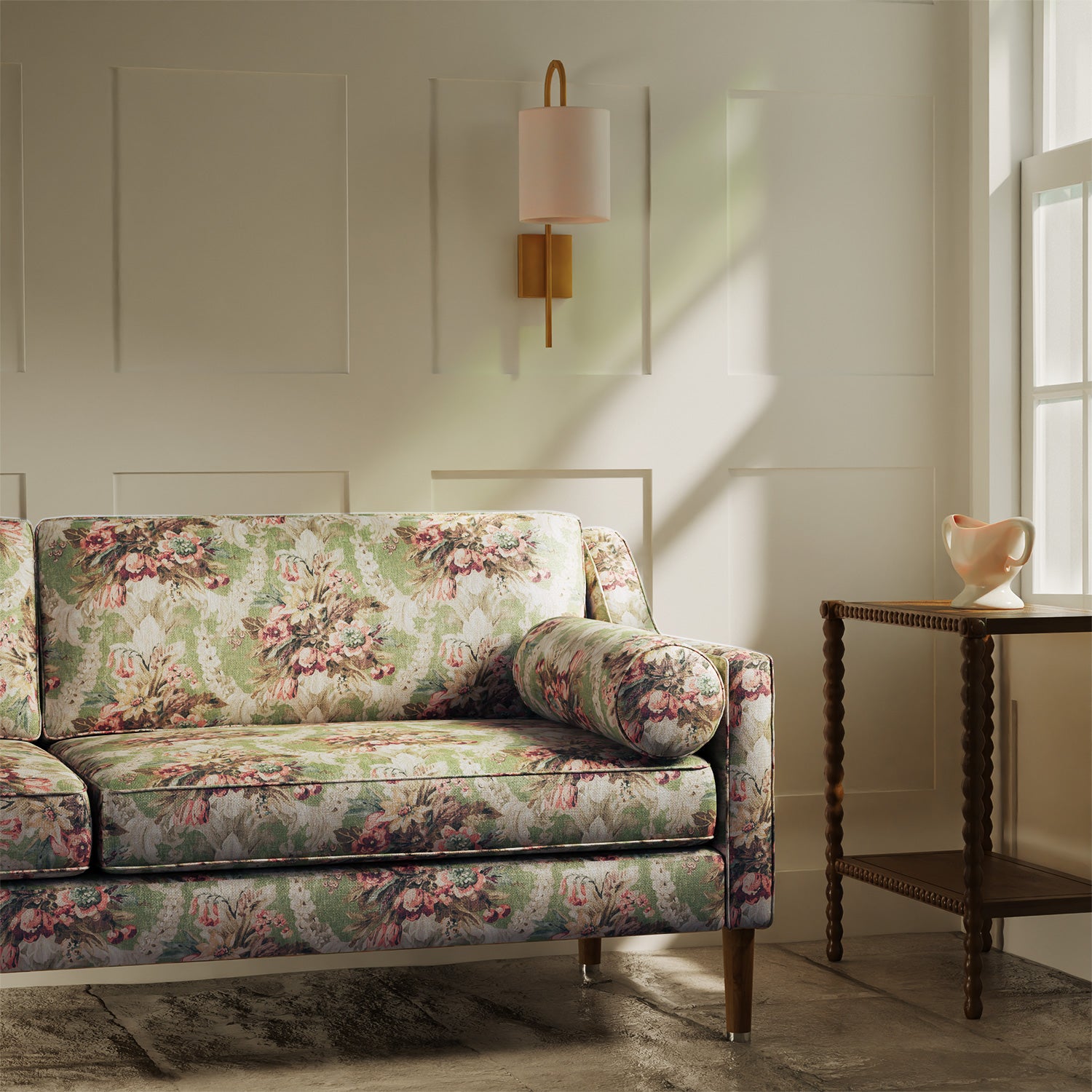 Sofa upholstered in a luxury green and pink floral bouquet fabric