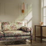 Sofa upholstered in a luxury green and pink floral bouquet fabric