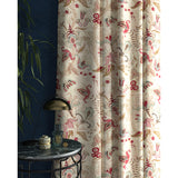 Curtain with a white fabric with pink and blue stylised floral design