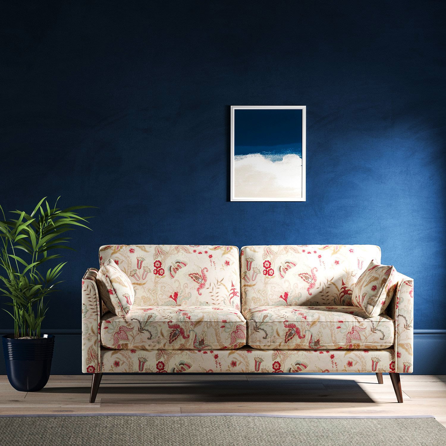 Sofa with a white fabric with pink and blue stylised floral design