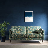 Sofa with a blue fabric with stylised floral design