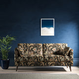 Sofa with a dark grey fabric with stylised floral design