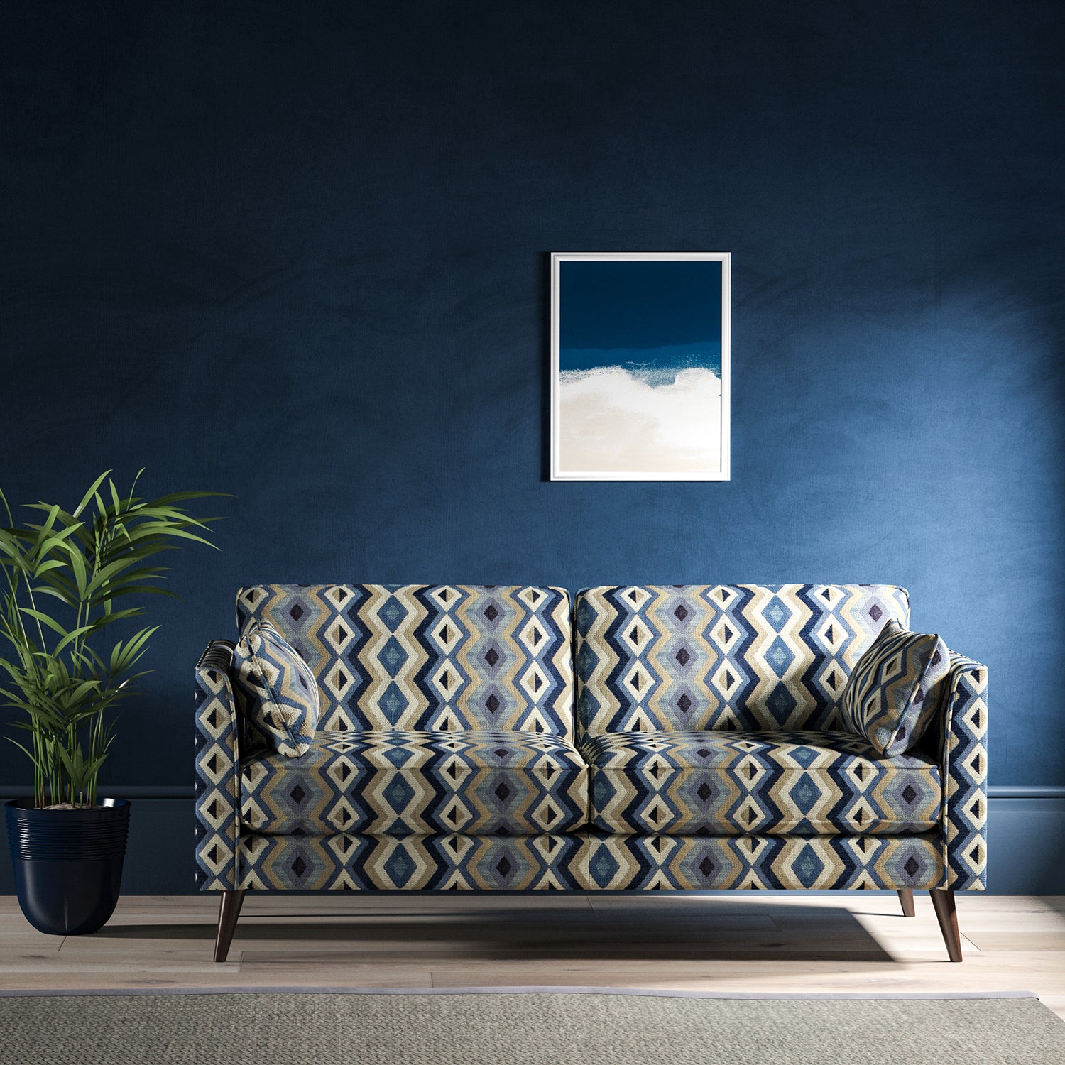 Sofa upholstered in a blue and neutral upholstery fabric with geometric Navajo inspired design
