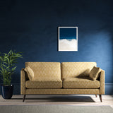 Sofa upholstered in a yellow and neutral jacquard weave upholstery fabric