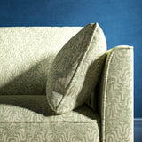 Sofa upholstered in a light turquoise and neutral jacquard weave upholstery fabric