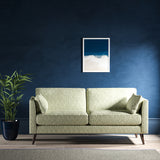 Sofa upholstered in a light turquoise and neutral jacquard weave upholstery fabric