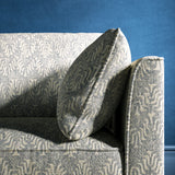 Sofa upholstered in a light blue and neutral jacquard weave upholstery fabric