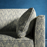 Sofa upholstered in a dark blue and neutral jacquard weave upholstery fabric