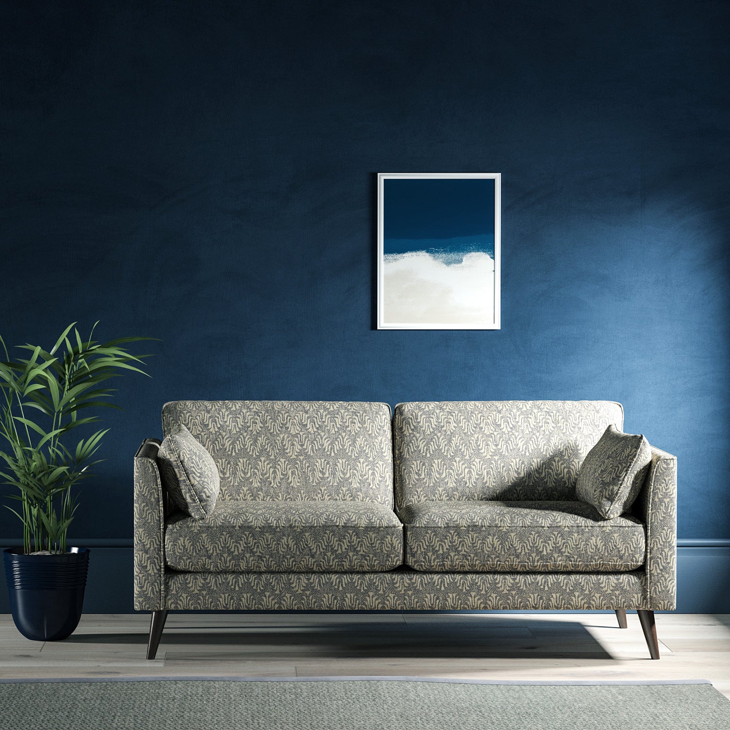 Sofa upholstered in a dark blue and neutral jacquard weave upholstery fabric