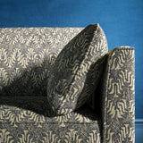 Sofa upholstered in a dark grey and neutral jacquard weave upholstery fabric