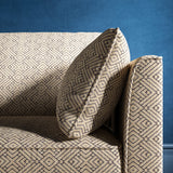 Sofa upholstered in a grey and neutral geometric weave upholstery fabric