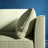 Sofa upholstered in a duck egg blue herringbone weave upholstery fabric