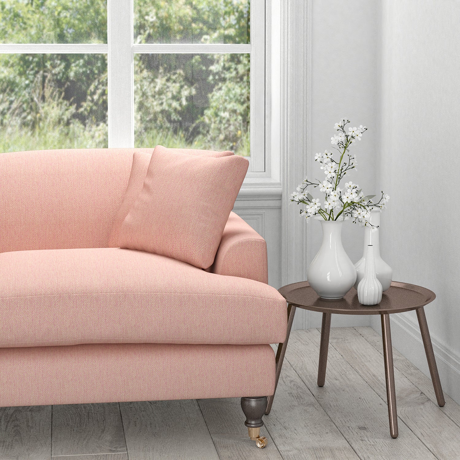 Sofa in a light pink upholstery fabric with a light neutral woven geometric design