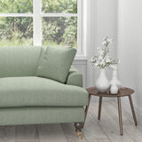 Sofa upholstered in a light blue fabric with a woven geometric design