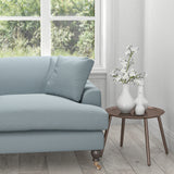 Sofa in a light blue fabric with neutral woven geometric design