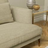 Sofa upholstered in a linen coloured plain linen blend fabric