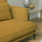 Sofa upholstered in a ochre yellow linen mix fabric
