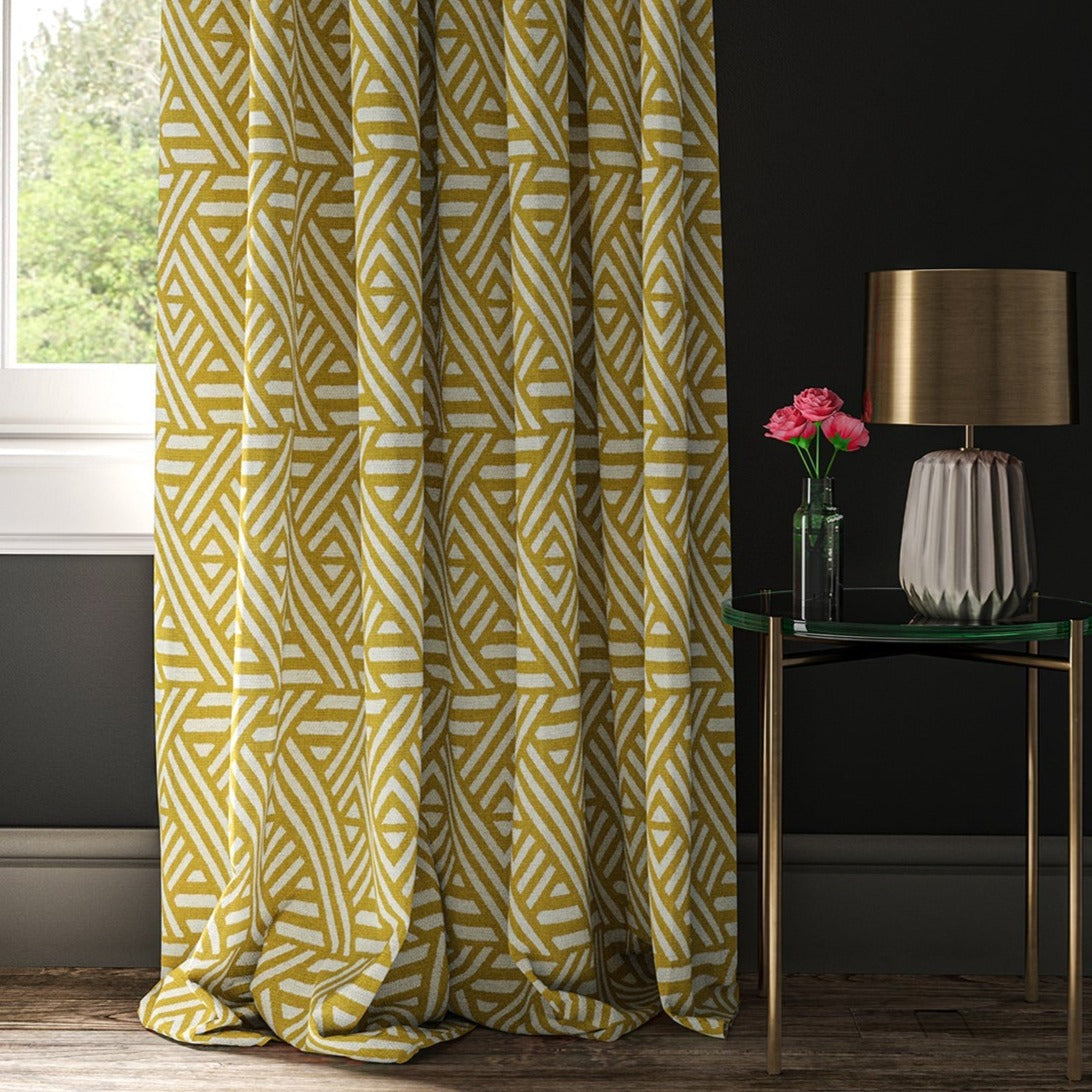 Curtain with a yellow and white geometric print fabric