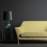 Sofa upholstered in a yellow and white large scale geometric print