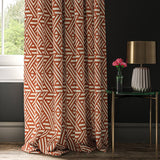 Curtain made with a orange and white geometric print fabric