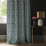 Curtain with a blue and white geometric print