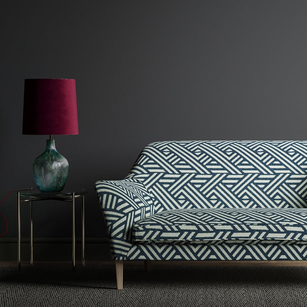 Sofa upholstered in a blue and white large scale geometric print