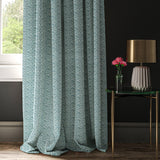 Curtain made with a blue and white wavy weave fabric.