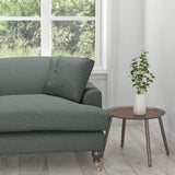Sofa upholstered in a dark blue plain cotton furnishing fabric