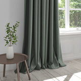 Curtain in a plain aqua cotton fabric with a stain resistant finish