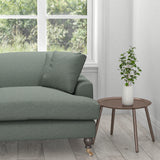 Sofa upholstered in a plain cotton washable aqua furnishing fabric