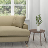 Sofa upholstered in a plain brown cotton furnishing fabric