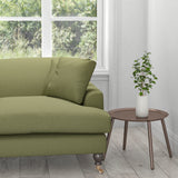 Sofa upholstered in a plain green khaki cotton upholstery fabric