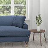 Sofa upholstered in a midnight blue plain cotton upholstery fabric