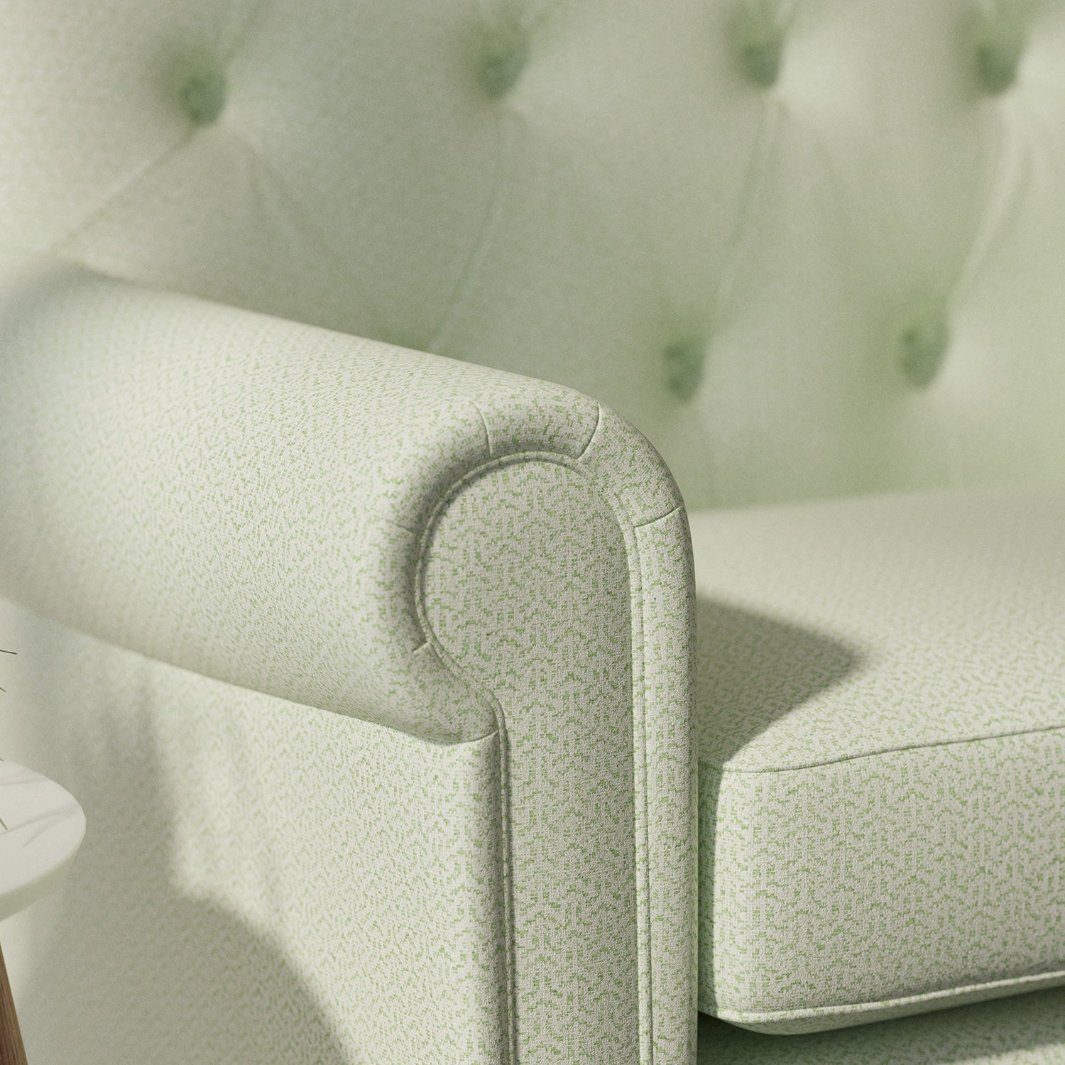 Sofa upholstered in a green Scandi-style semi-plain upholstery fabric with a stain resistant finish